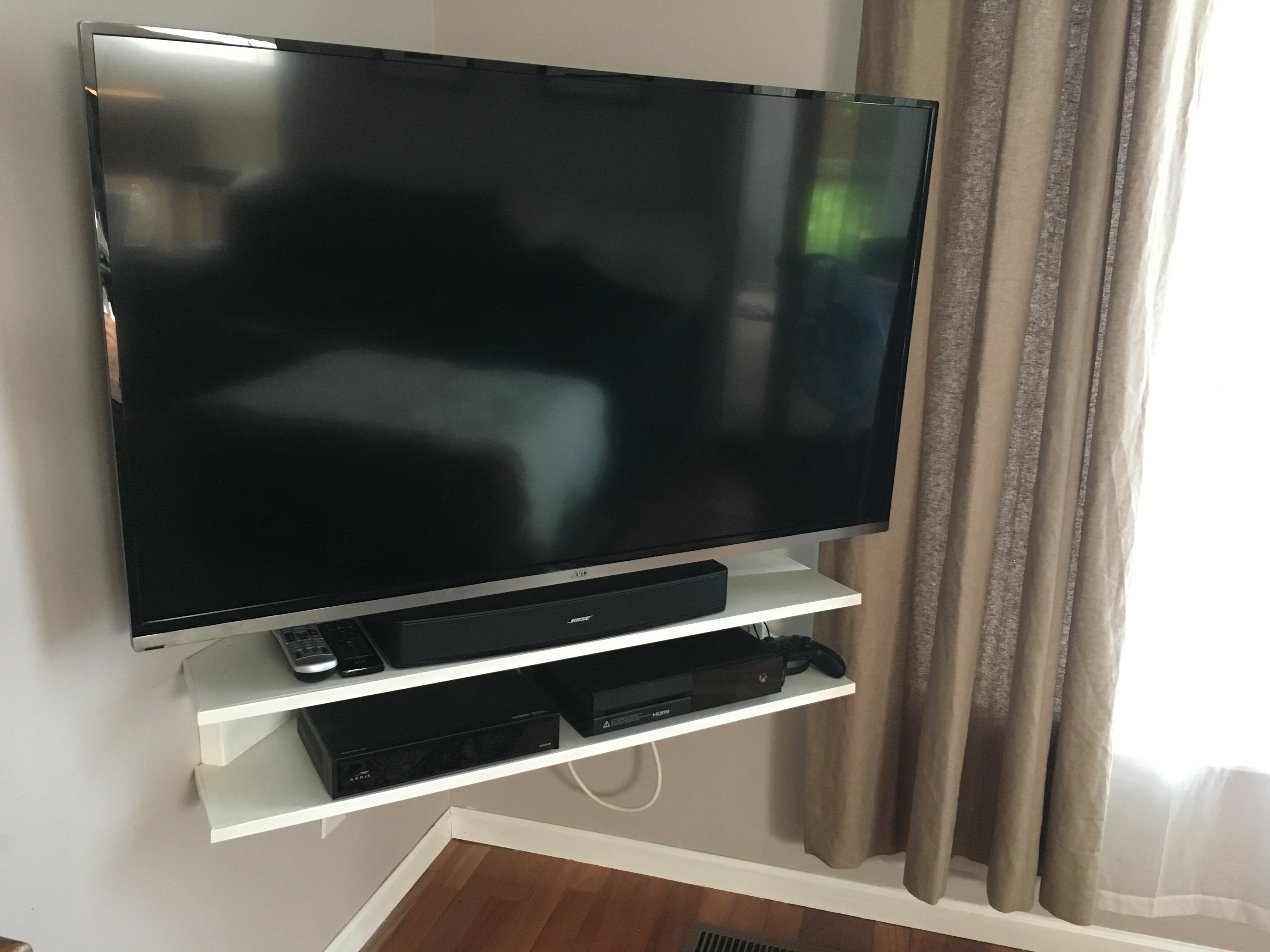 Mounted TV and Corner Floating Shelf - Verlo House to Home